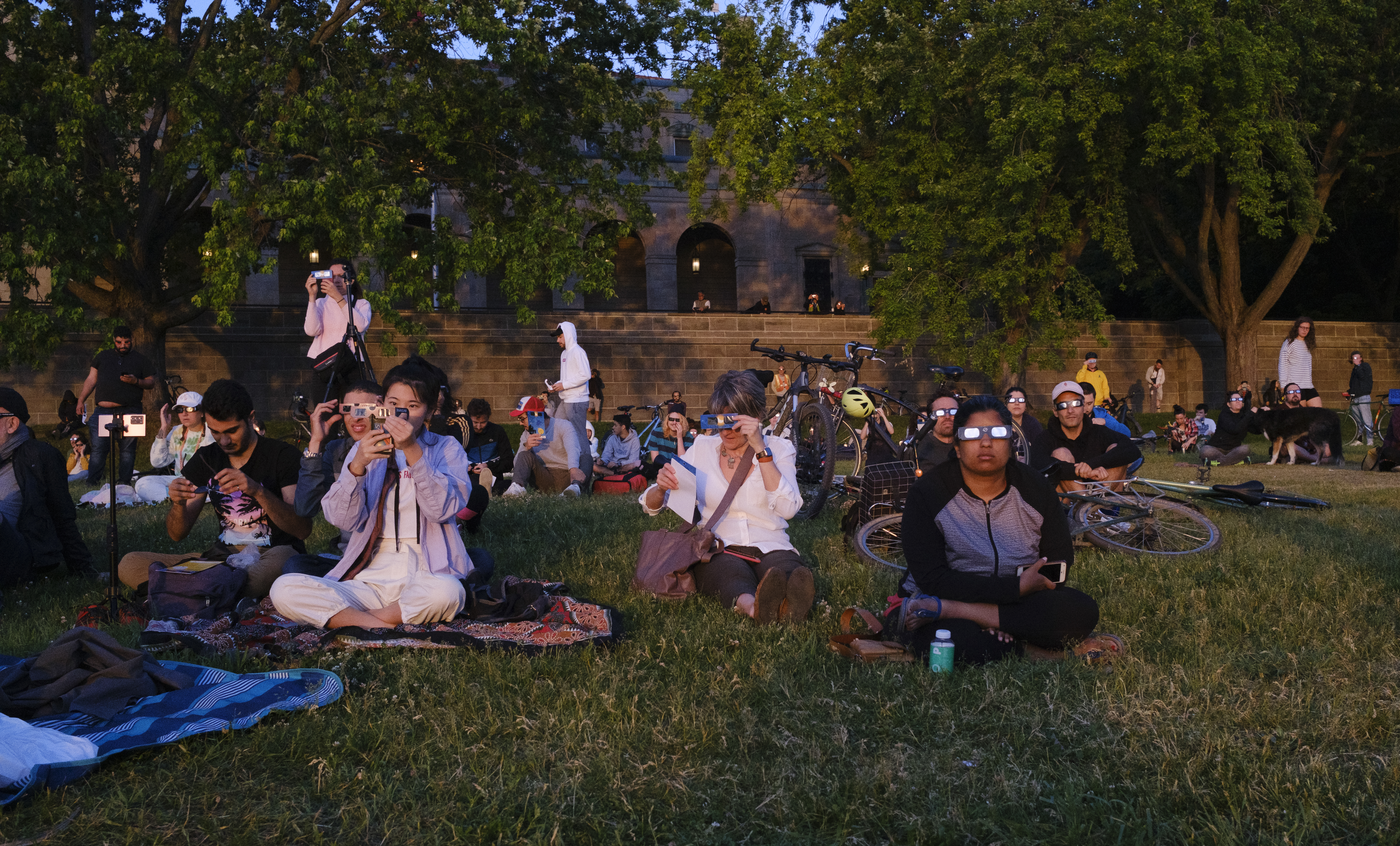 People watching the partial solar eclipse over Montréal in June 2021