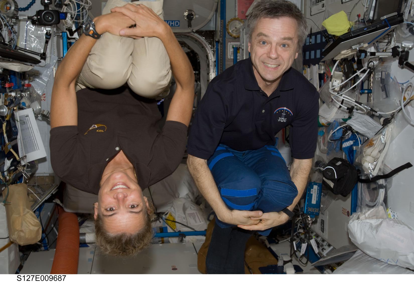 Julie Payette and Robert Thirsk in space