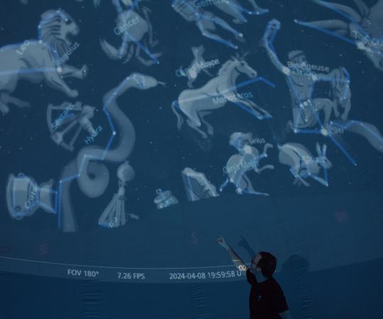 Trevor displays constellations in the planetarium dome