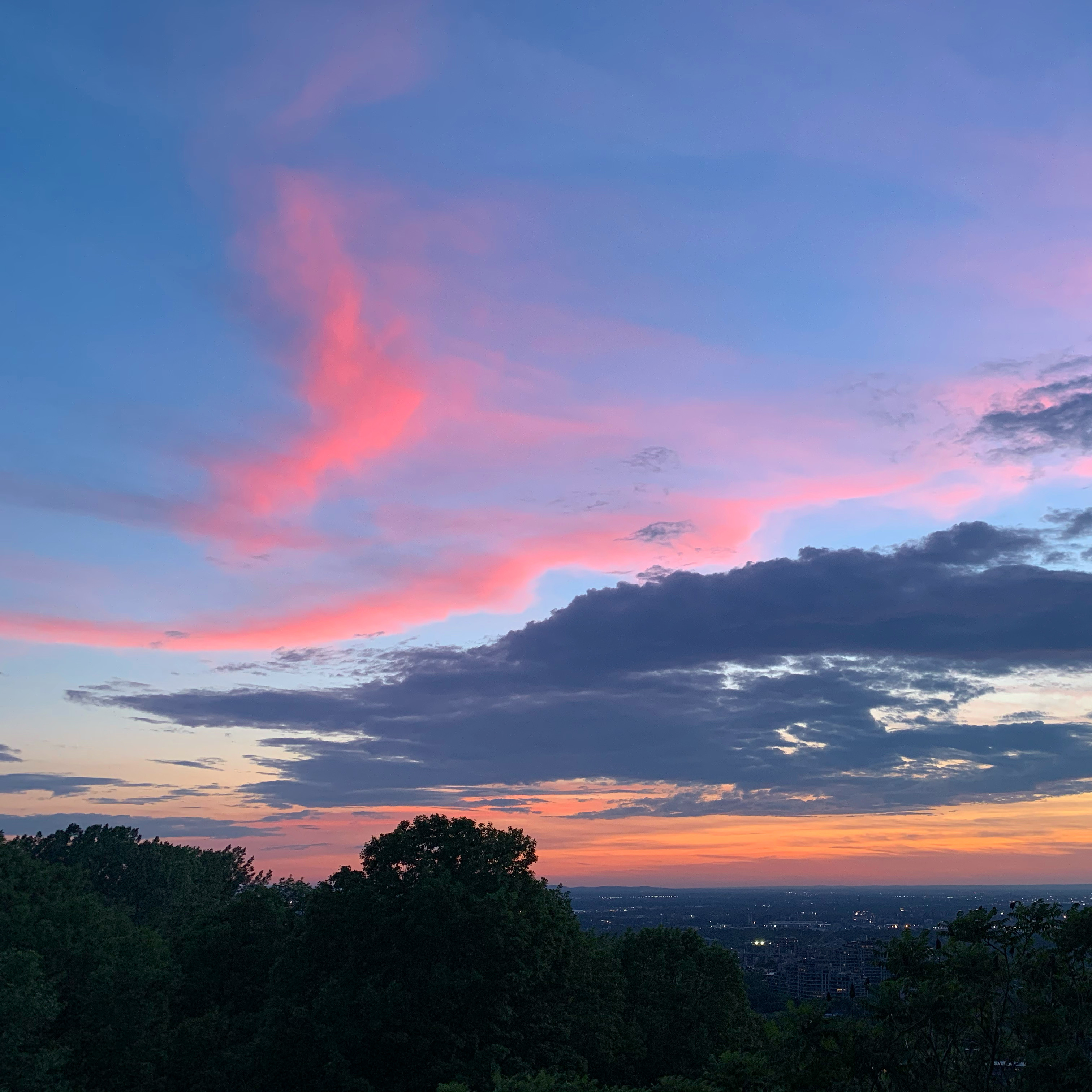 High-altitude reddish-pink clouds in the West