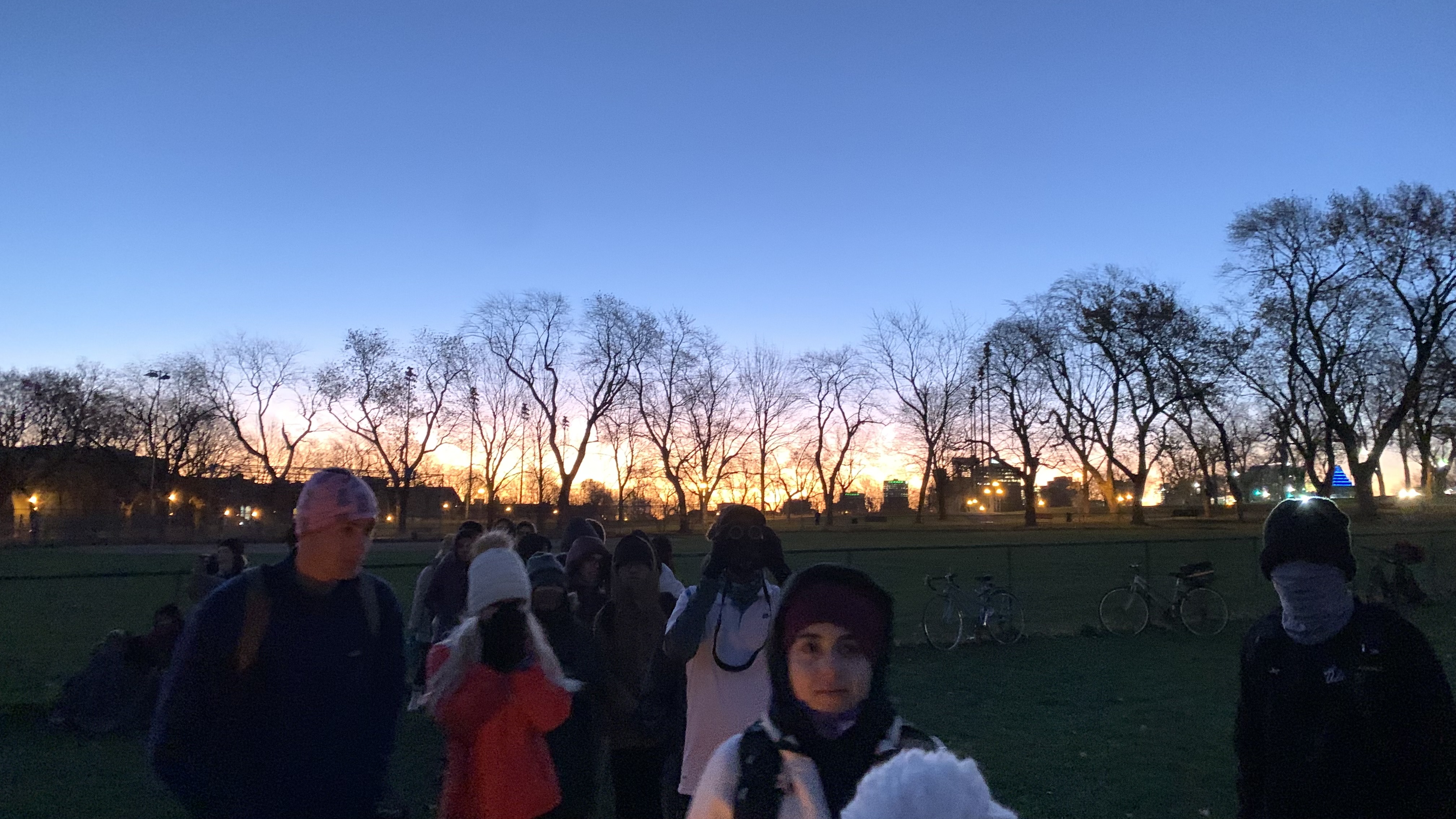 Crowd lined up to look through telescope at Jeanne Mance Park to see lunar eclipse